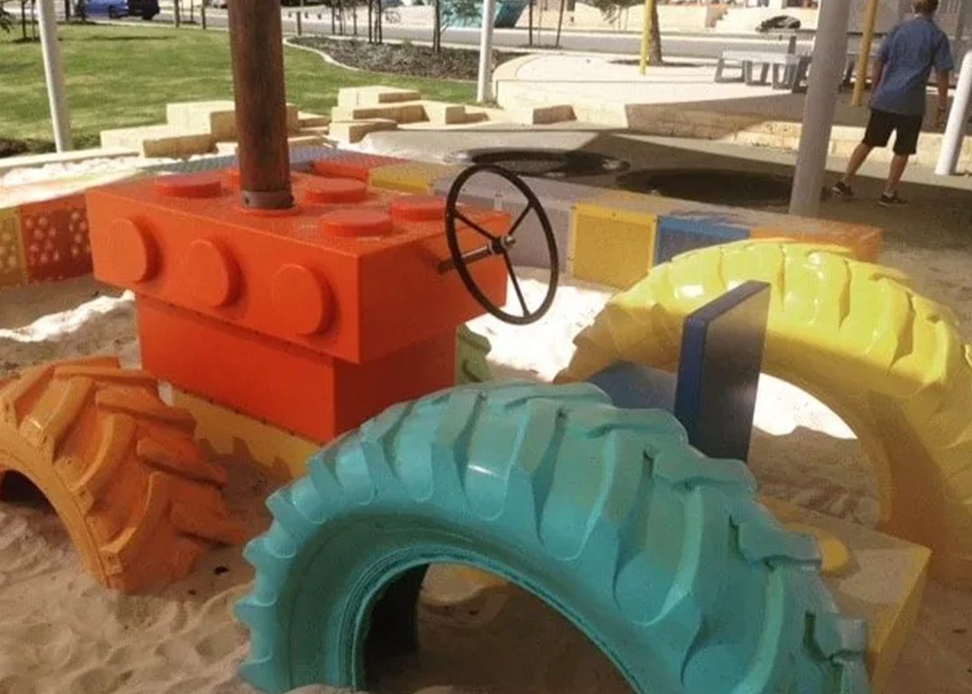 Plastic tractor in a playground.