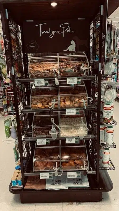 a display case in a store filled with lots of pastries.