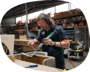Man welding plastic product.
