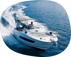 two people on a boat gliding through the ocean.