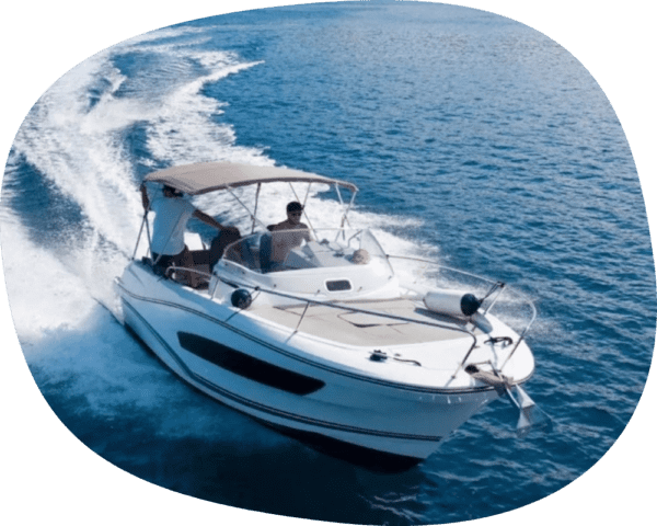 two people on a boat gliding through the ocean.