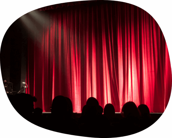 red theatre closed curtains.