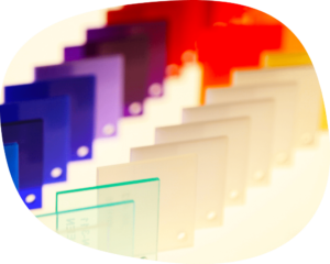 a group of different colored plastic plates on a table.