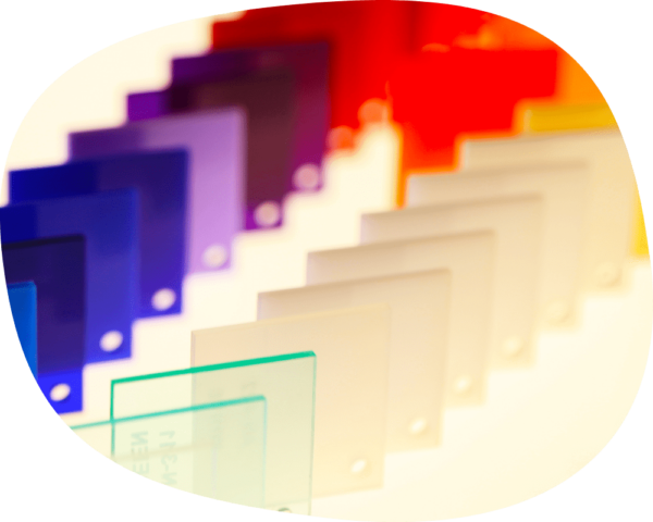 a group of different colored plastic plates on a table.