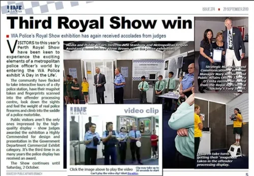 a newspaper article with a group of people standing around.