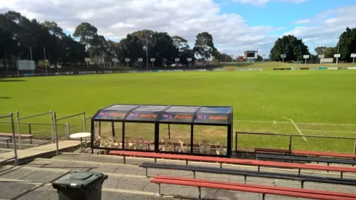a large field with benches and an interchange.