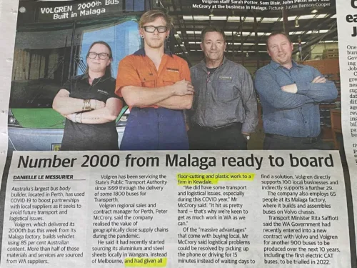 a newspaper article with a picture of three men.