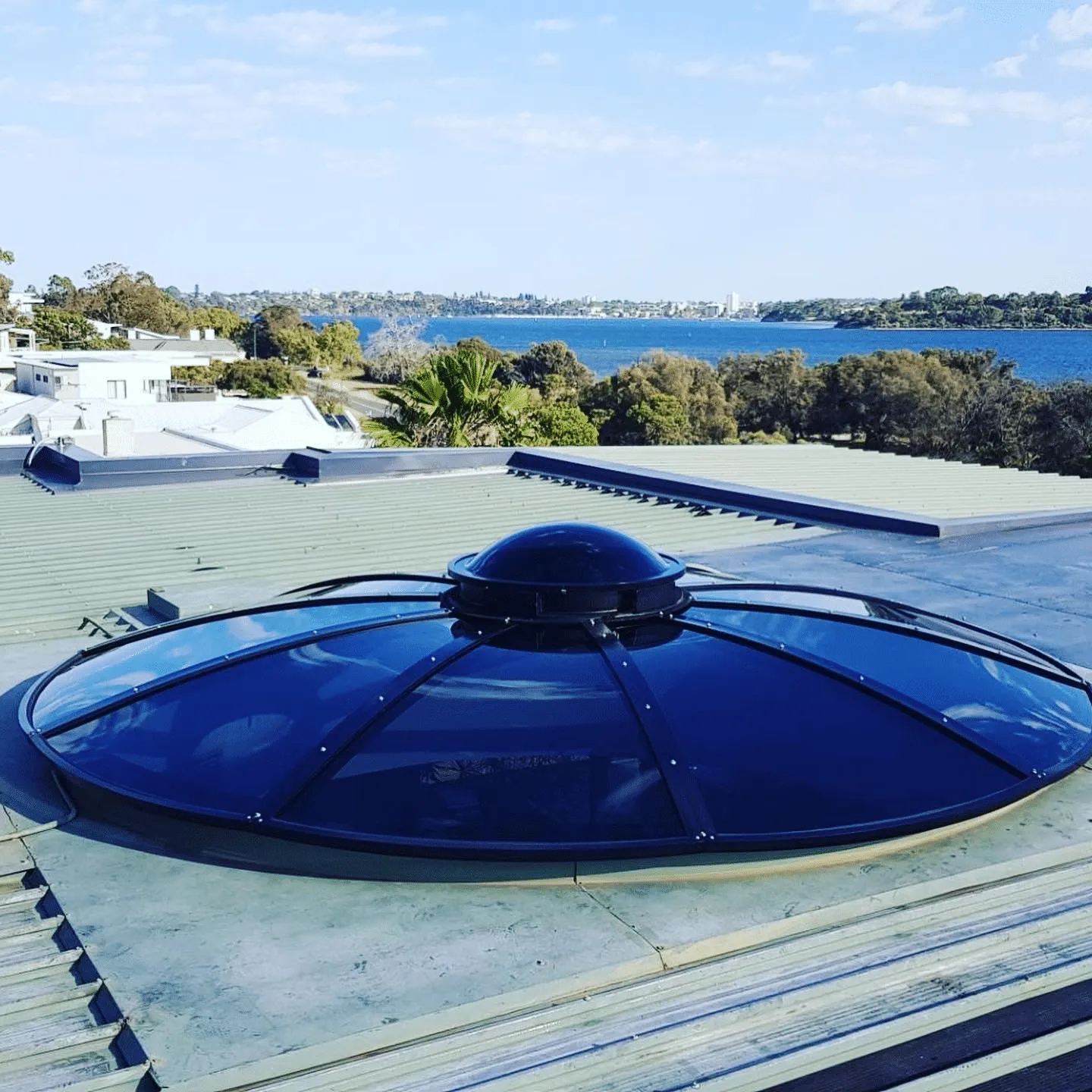 a large blue object on top of a roof.
