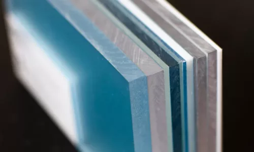 a close up of a stack of blue and silver sheets.