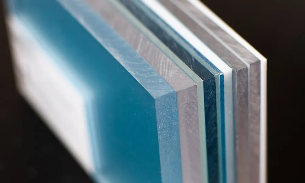 a close up of a stack of blue and silver sheets.