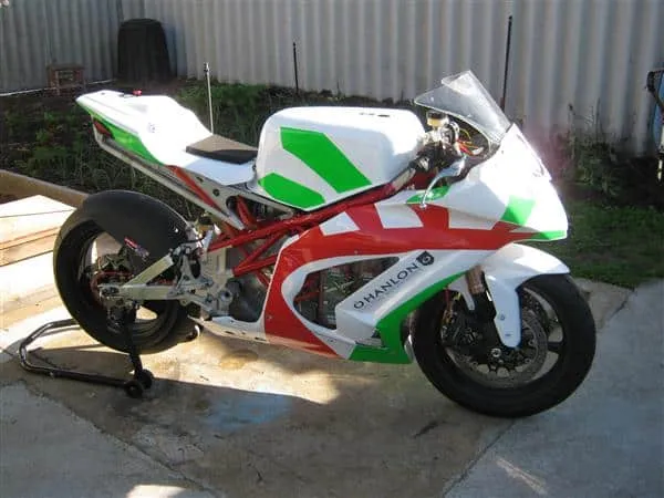 Photos of a green, whiet and red motorbike